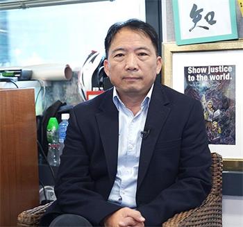 图6：民主党主席、立法会议员胡志伟