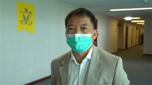 '图9：民主党主席、立法会议员胡志伟'